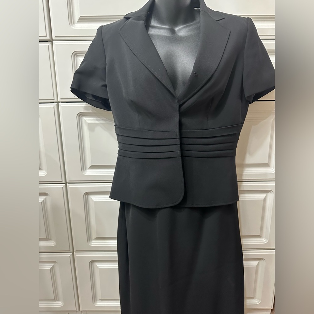 Fashionable black skirt suit.